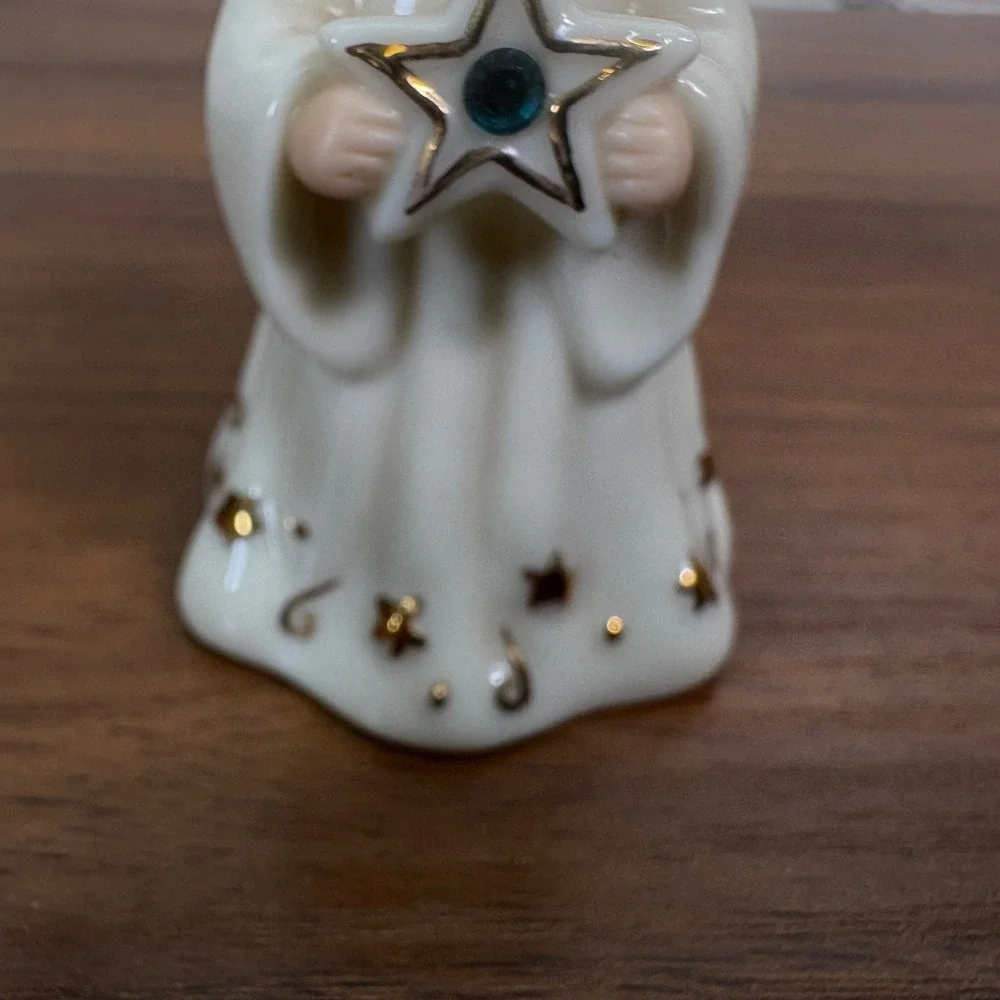 Lenox May birthstone Porcelain Angel Ornament features a hand-painted gold halo